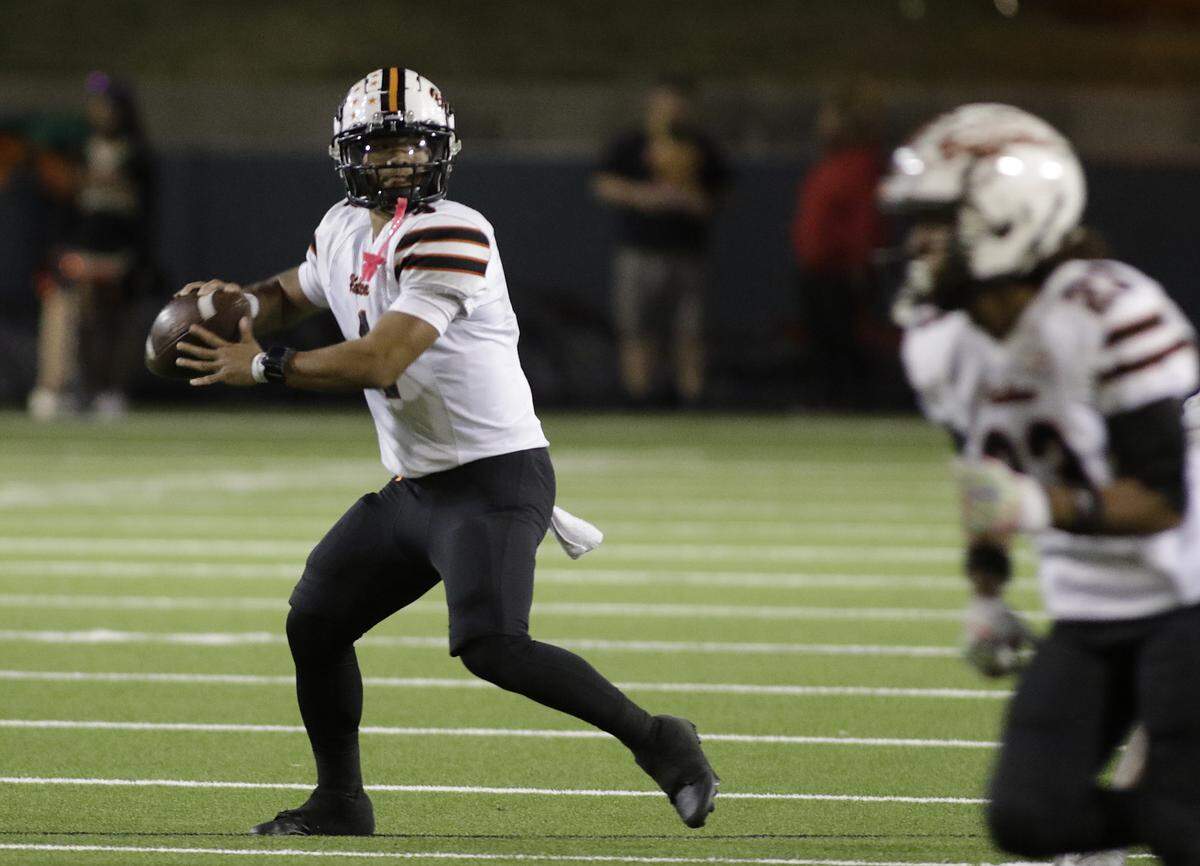Haltom’s Dominique Mounivong looks for a receiver against South Grand Prairie during their game at the Gopher-Warrior Bowl on Friday, Oct. 31, 2025. 