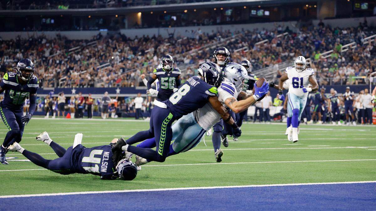 Dallas Cowboys tight end Peyton Hendershot lays out to reach the end zone for the game-winning touchdown against Seattle on Friday at AT&T Stadium.
