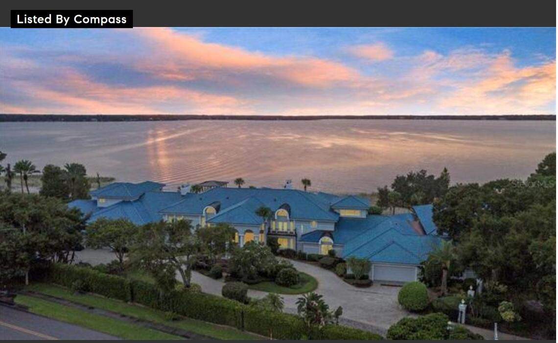 Outside shot of mega-mansion on the water.