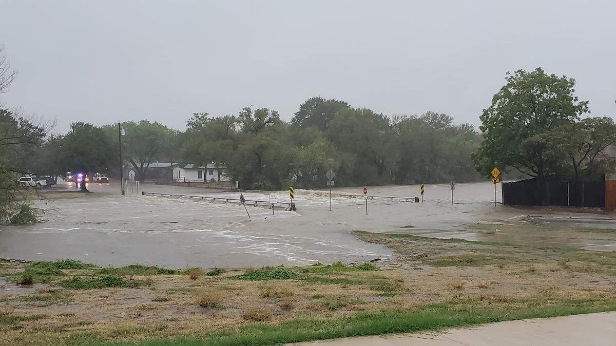 Water has crested on many bridges along the creeks in Haltom City, according to the police department. Residents are asked to stay away from flooded areas because “water like this will sweep even heavy vehicles off the road easily,” police said. The bridge pictured is adjacent to Haltom Middle School.