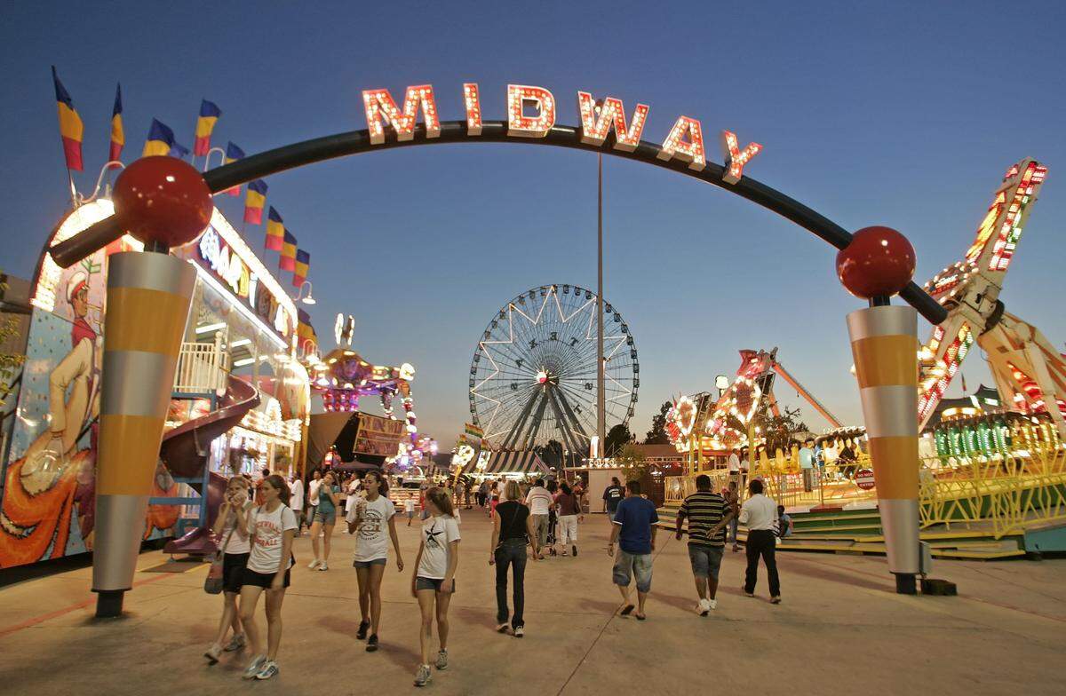 Oct. 5, 2005: Fair-goers walk the Midway at the State Fair of Texas in Dallas.