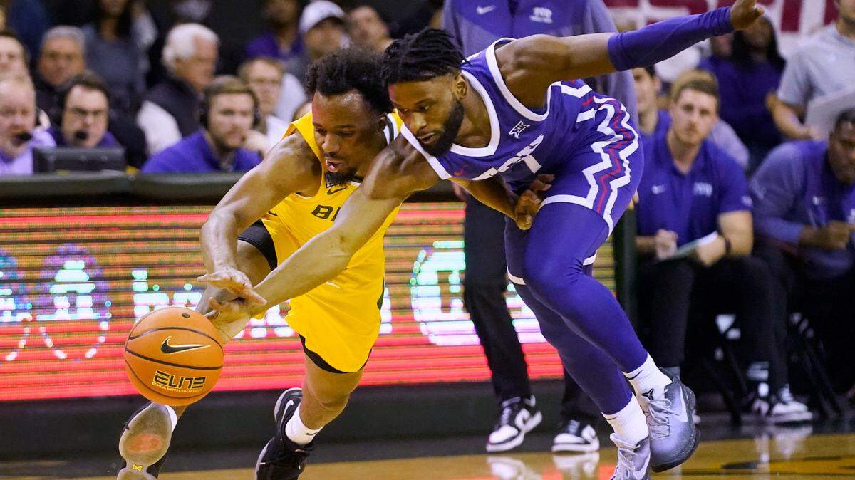 TCU guard Mike Miles Jr., right, and Baylor guard LJ Cryer chase the ball during the first half of an NCAA college basketball game in Waco, Texas, Wednesday, Jan. 4, 2023. (AP Photo/LM Otero)