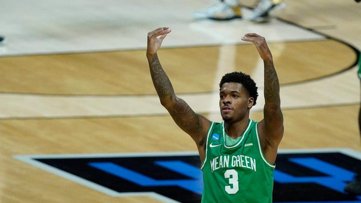 North Texas’ Javion Hamlet reacts to fans during the Mean Green’s first NCAA Tournament victory in program history Friday night in Indianapolis.