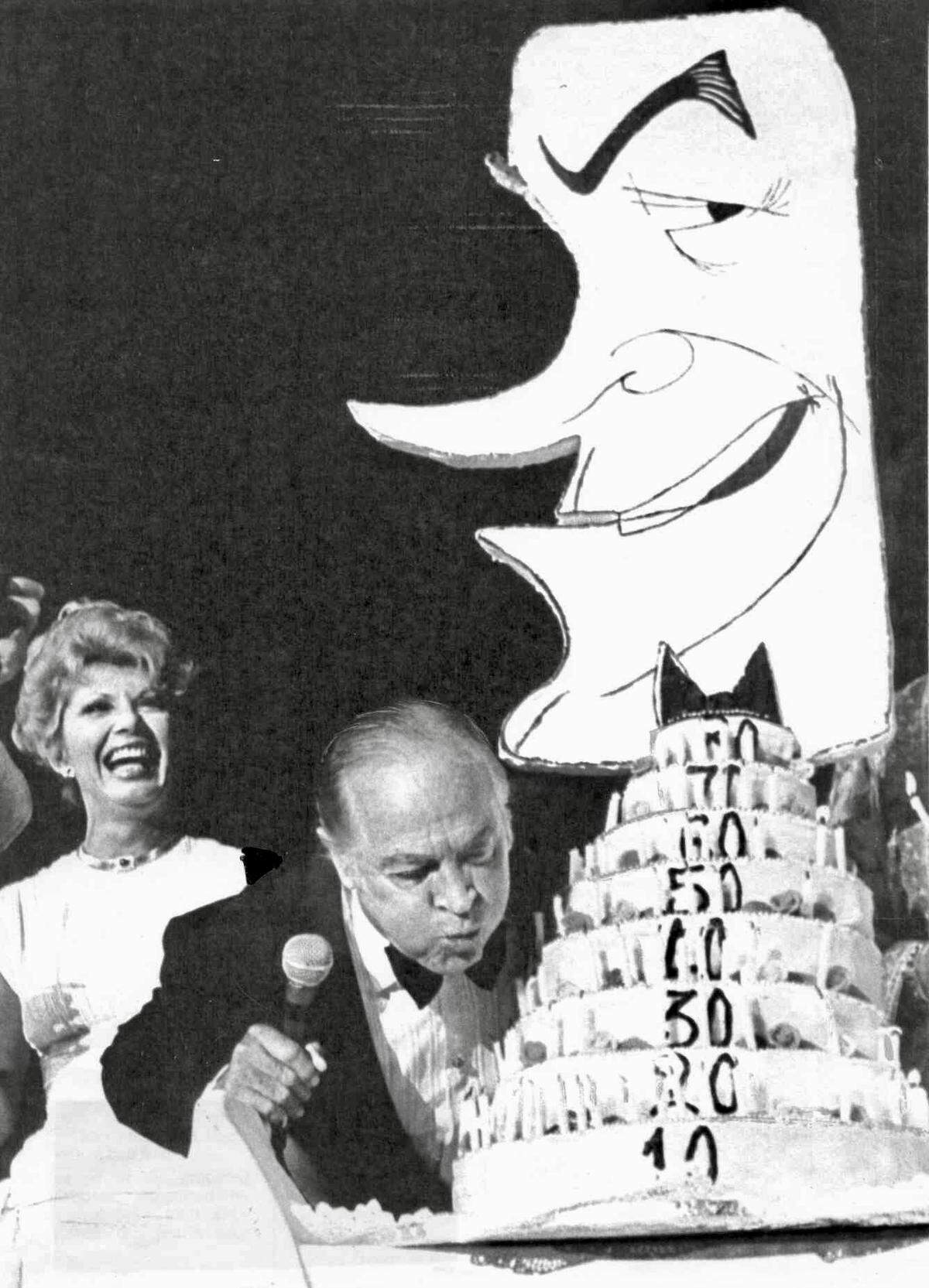 Bob Hope celebrates his 80th birthday at a benefit performance in Fort Worth, Texas while entertainer Ruta Lee laughs in the background.
