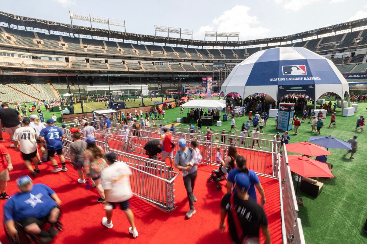 Fans make their way down to the Play Ball Field for the first day of the 2024 MLB All-Star Village at Choctaw Stadium in Arlington on Saturday, July 13, 2024.