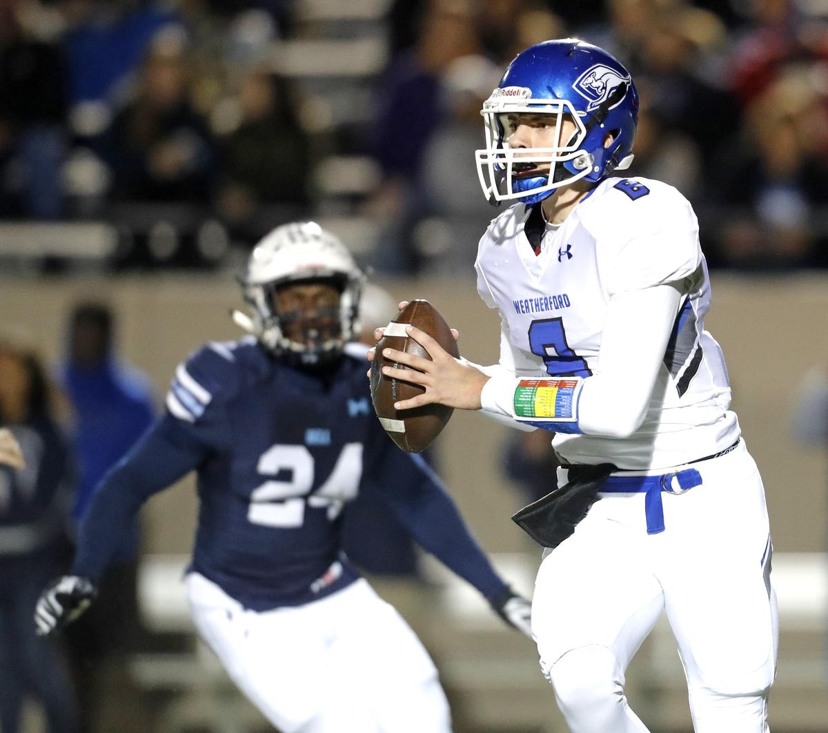 Weatherford quarterback Ken Seals looks for an opening against L.D. Bell on Nov. 9, 2018, at Pennington Field in Bedford.