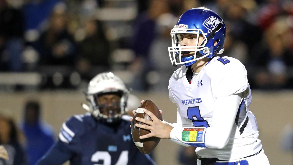 L.D. Bell defensive back Joel Kayoka (24) zeros in on Weatherford quarterback Ken Seals (8) during the first half of a high school football game at Pennington Field in Euless, Texas, Friday, Nov. 09, 2018. The Weatherford Roos led the Raiders 14-9 at the half. (Special to the Star-Telegram Bob Booth)


