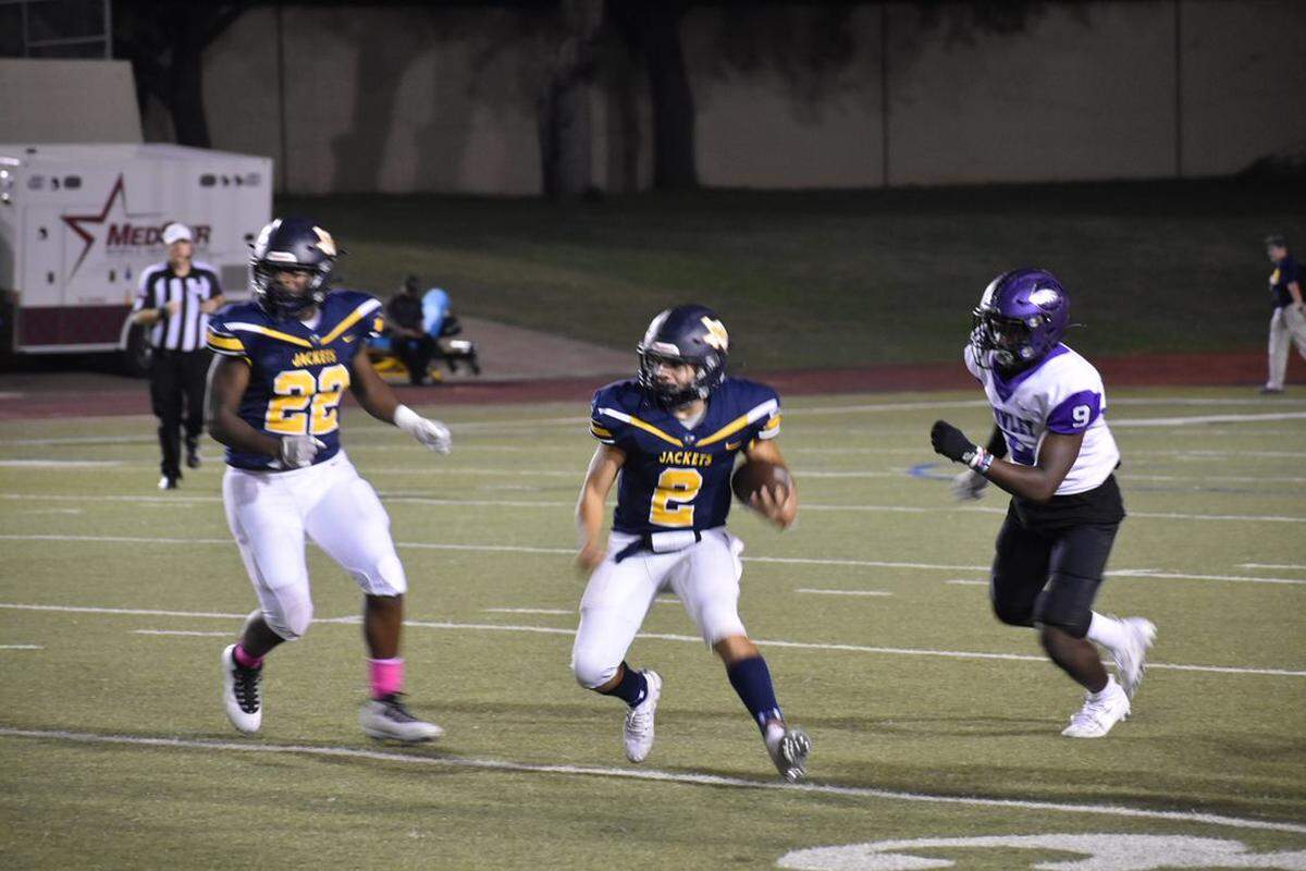 Arlington Heights Zacary Garcia (2) freshman calls a designated QB run during a high school football game at Farrington Field in Fort Worth, Texas, Thursday, October 21, 2021. Crowley won 41-14. (Luke Zentner/special to the Star-Telegram)