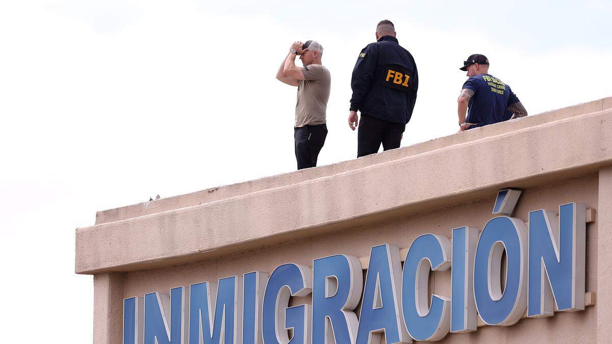 FBI agents investigate the scene where a shooting at an Immigration and Customs Enforcement facility occurred in Dallas on Wednesday, Sept. 24, 2025.