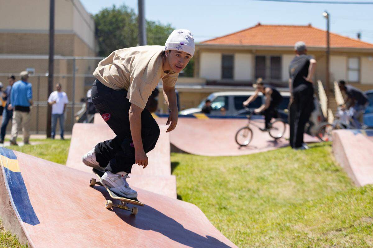 Andres Escobar, 16, lands a jump at the Dickies Skate Plaza in Fire Station Park on Saturday, April 29, 2023 in Fort Worth. The opening day event featured live music, food trucks and local vendors like Magnolia Skate Shop.