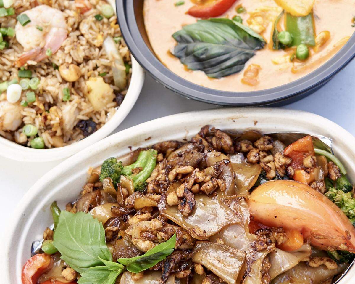 Drunken noodles, pineapple fried rice with shrimp and red panang curry at Zaap Kitchen.