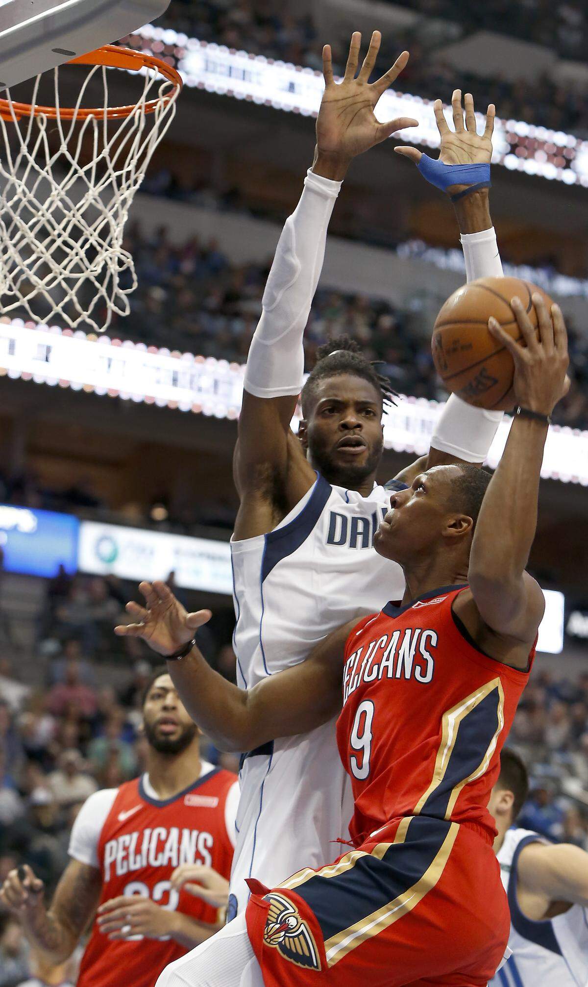New Orleans Pelicans guard Rajon Rondo (9) drives against Dallas Mavericks center Nerlens Noel (3) during the first half of an NBA basketball game on Sunday, March 4, 2018, in Dallas.