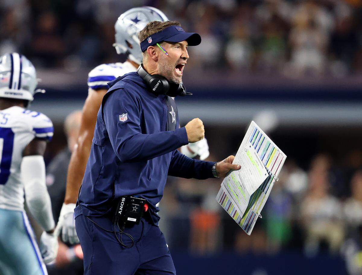 Dallas Cowboys head coach Brian Schottenheimer celebrates a touchdown during the fourth quarter Sunday.