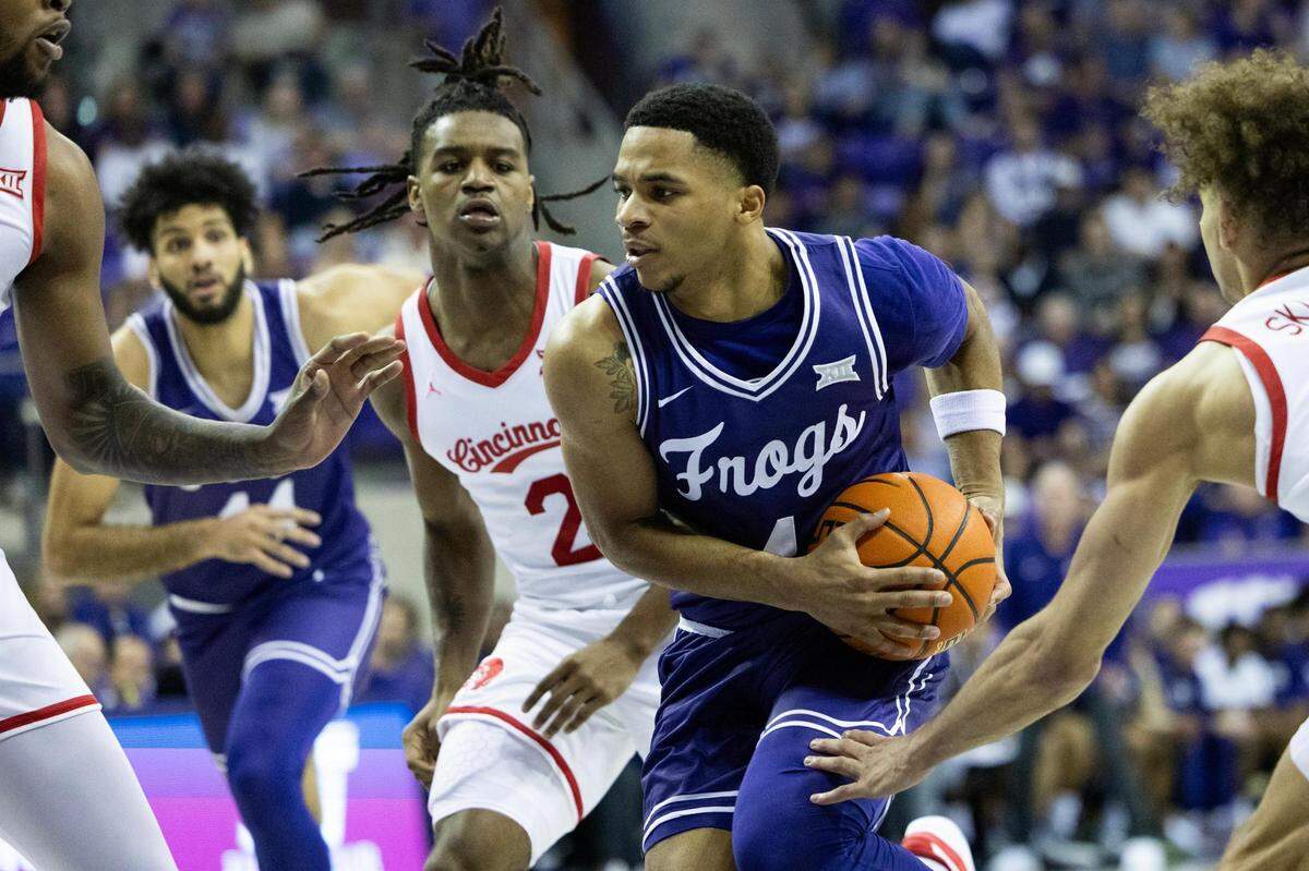 TCU guard Jameer Nelson Jr. (4) drives to the basket during the first half against the Cincinnati Bearcats at Schollmaier Arena in Fort Worth on Saturday.