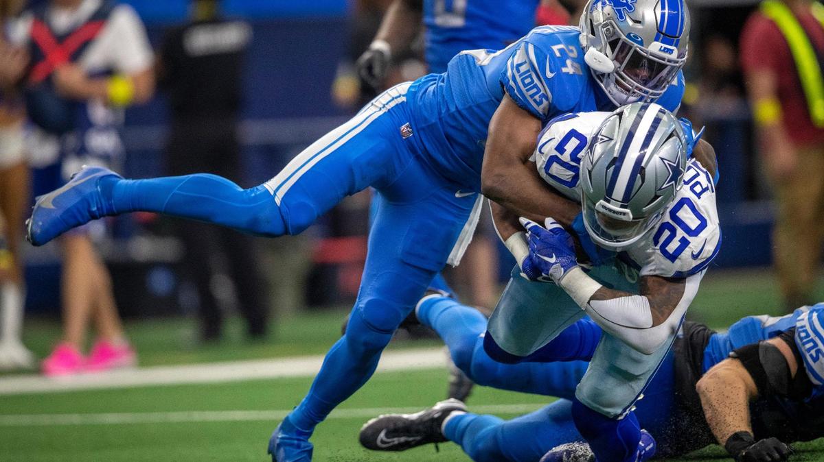 Dallas Cowboys running back Tony Pollard is tackled by Detroit Lions cornerback Amani Oruwariye after completing a pass at the AT&T Stadium in Arlington on Sunday, Oct. 23, 2022.