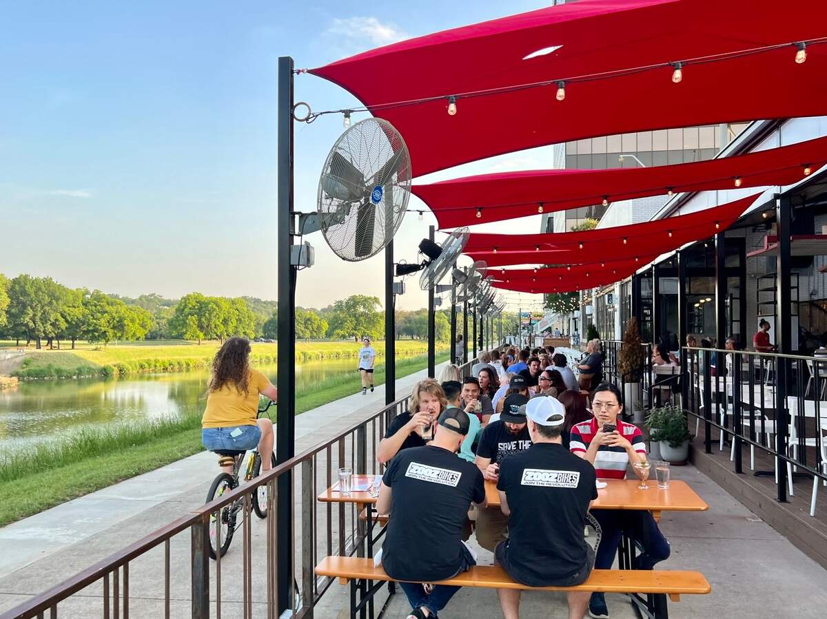 The patios at HG Sply Co., Quince and Ascension Coffee hug the Trinity Trail near the Fort Worth Zoo and Colonial Country Club May 22, 2023.