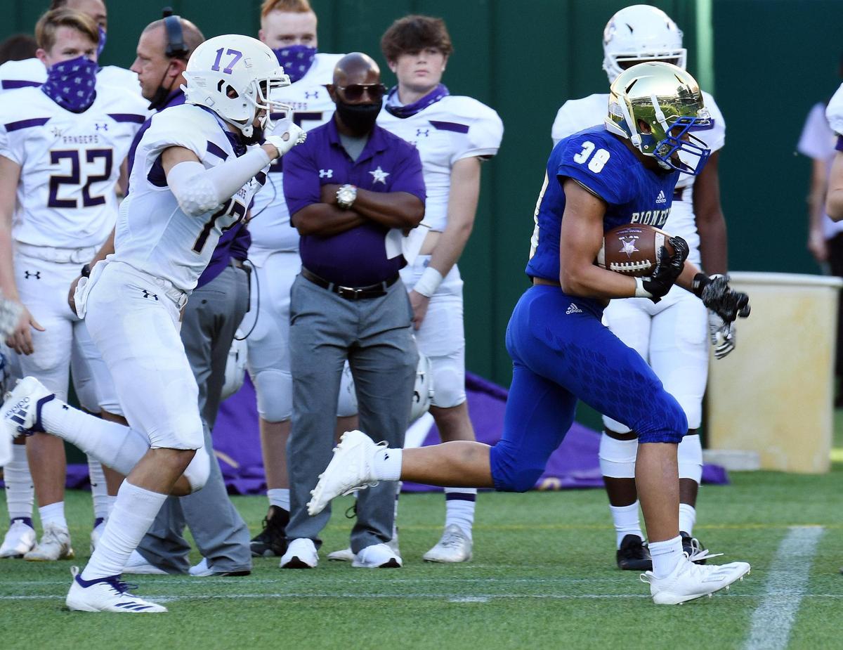 Chisholm Trail’s Bryce Hollingsworth left chases Boswell’s Ezra Carter as he takes in inteception in for the touchdown to take a 16-6 lead in the second quarter of their District 3-6A football game Saturday, November 7, 2020 at Globe Life Park in Arlington, Texas. Special/Bob Haynes