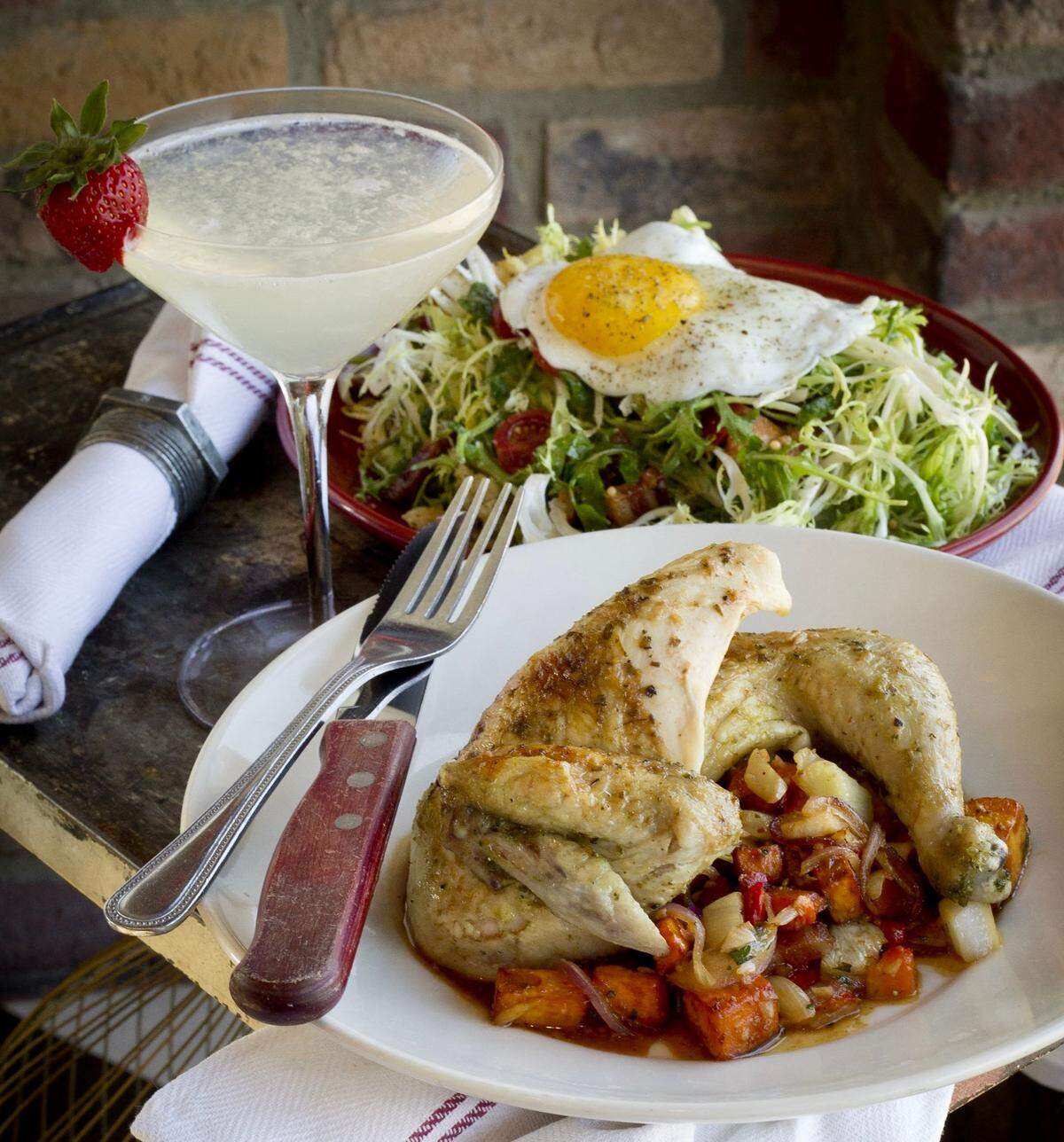 Roast chicken with a “bacon and egg” salad at Whiskey Cake.