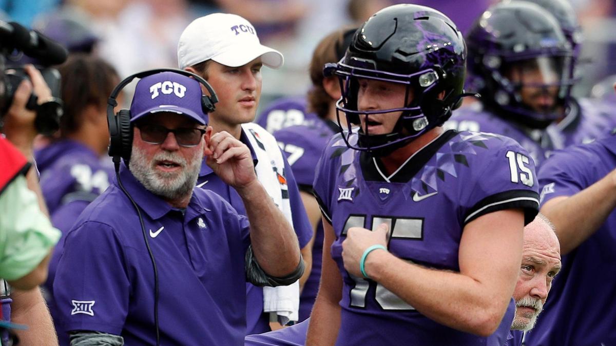 TCU coach Jerry Kill, left, discusses strategy with quarterback Max Duggan during the Horned Frogs’ game against Texas on Oct. 2. On Sunday, Kill was named interim head coach after Gary Patterson and the university parted ways.