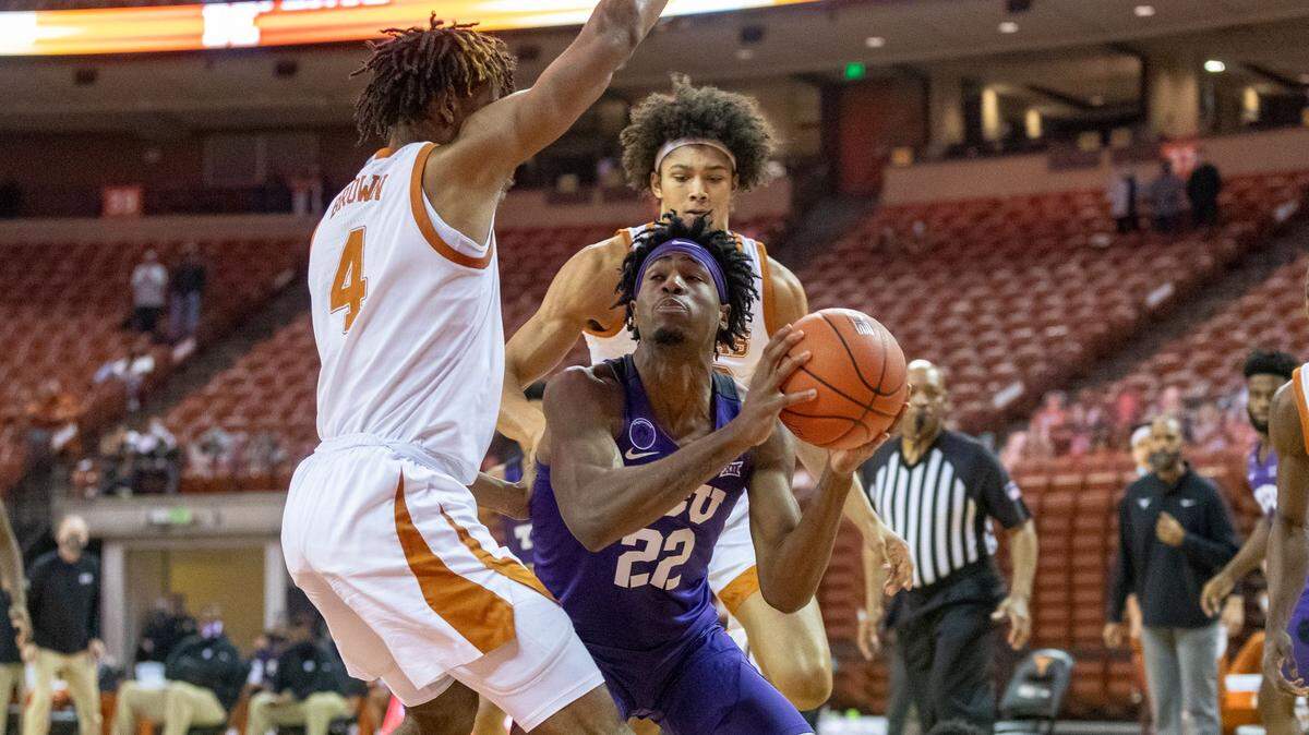 TCU’s RJ Nembhard, center, scored 15 points in Saturday’s loss at Texas. The Frogs are scheduled to host host Texas Tech on Monday night, but that game will likely be postponed because of inclement weather, according to a source.