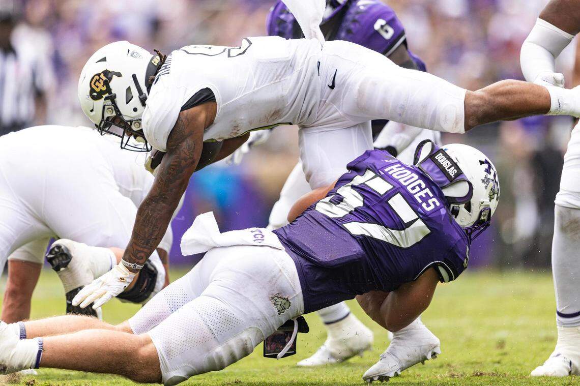 TCU linebacker Johnny Hedges (57) tackles Colorado running back Anthony Hankerson (9) in the second quarter of a college football game between the TCU Horned Frogs and the Colorado Buffaloes at Amon G. Carter Stadium in Fort Worth on Saturday, Sept. 2, 2023.