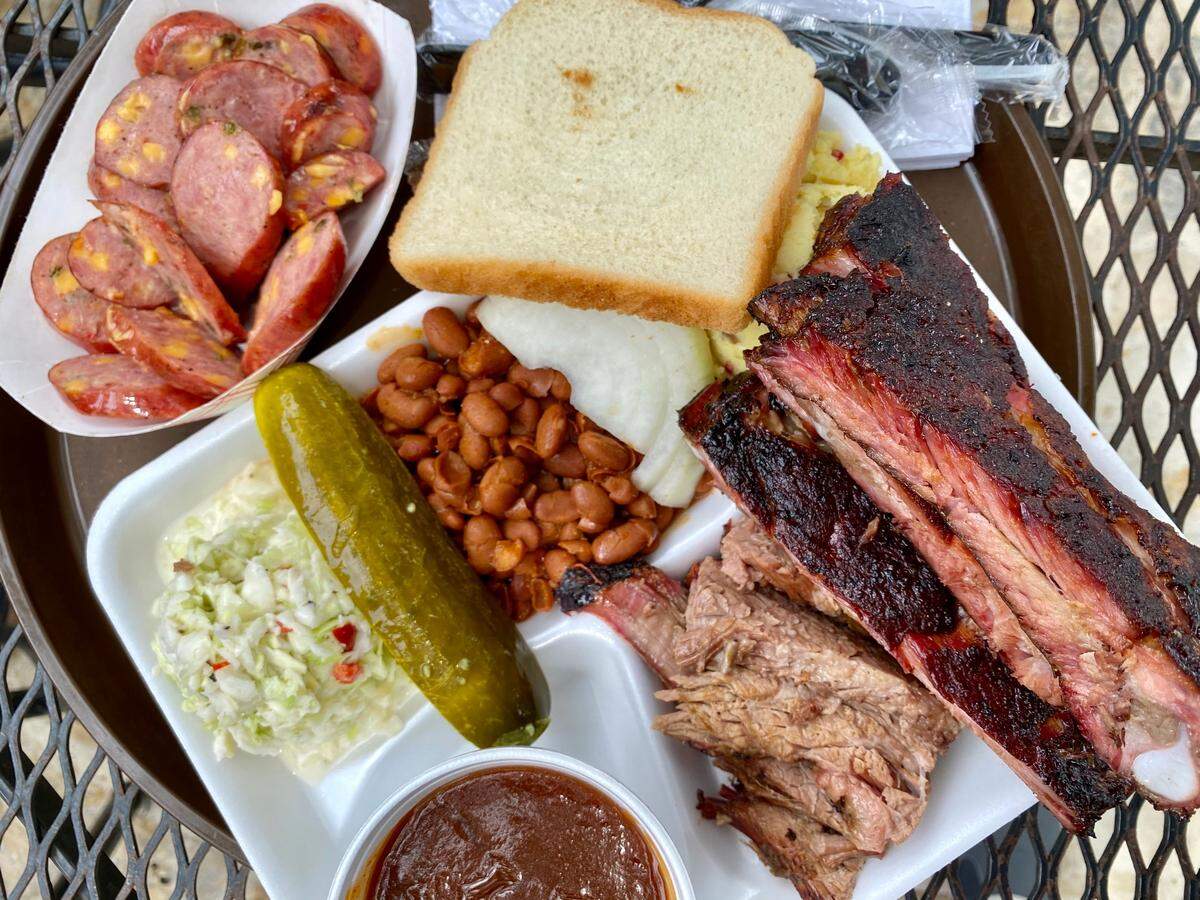 A Railhead Smokehouse platter with brisket, pork ribs and jalapeno-cheddar sausage.