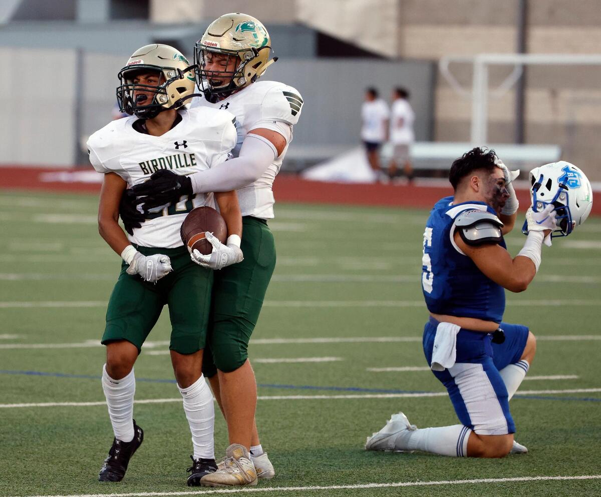 Birdville defensive lineman Daniel Sabillion (34) congratulates /20/ after a recovered fumble afterin the first half of a UIL football game at Standridge Stadium in Carrollton, Texas, Thursday Sept. 07, 2023. Birdville led 27-12 at the half. (Special to the Star-Telegram Bob Booth)