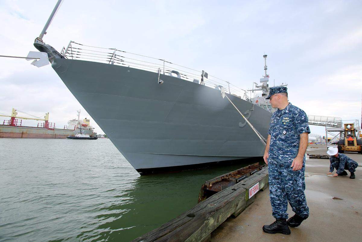 Navy Cmdr. Randy Blankenship does a visual inspection of the USS Fort Worth as it docks in Galveston, Texas, on Sept. 17, 2012.