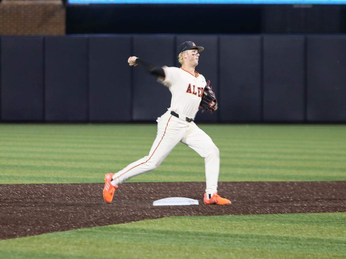 Aledo second baseman Landon Barnes turns a double play in the third inning against McKinney North in Game 1 of their UIL Class 5A Division I state semifinal baseball game on Thursday, May 28, 2026, at Horner Ballpark on the Campus of Dallas Baptist University in Dallas, Texas.