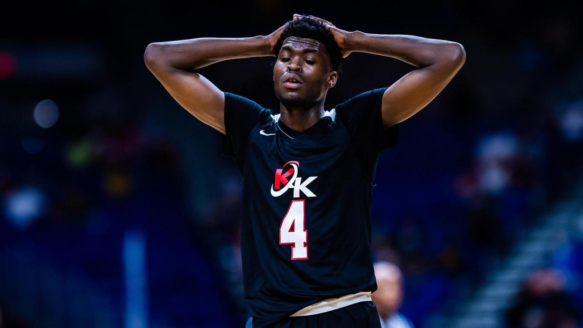 Dallas Kimball senior Kyron Henderson was arrested on two felony gun charges after a gun in his possession accidentally discharged and struck a female team trainer in the left ankle.