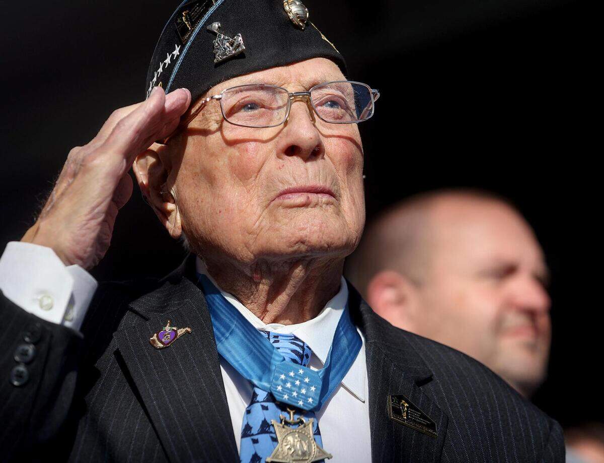 World War II veteran Hershel “Woody” Williams salutes the flag during the National Medal of Honor Museum groundbreaking on March 25, 2022.