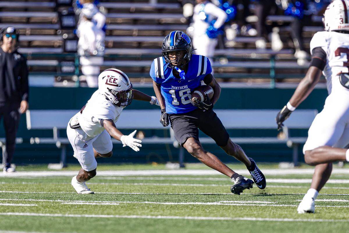 North Crowley wide receiver Asaiah Smith (18) picks up yardage after a catch against Midland Legacy in a Class 6A Division I area-round playoff Saturday at Shotwell Stadium in Abilene.
