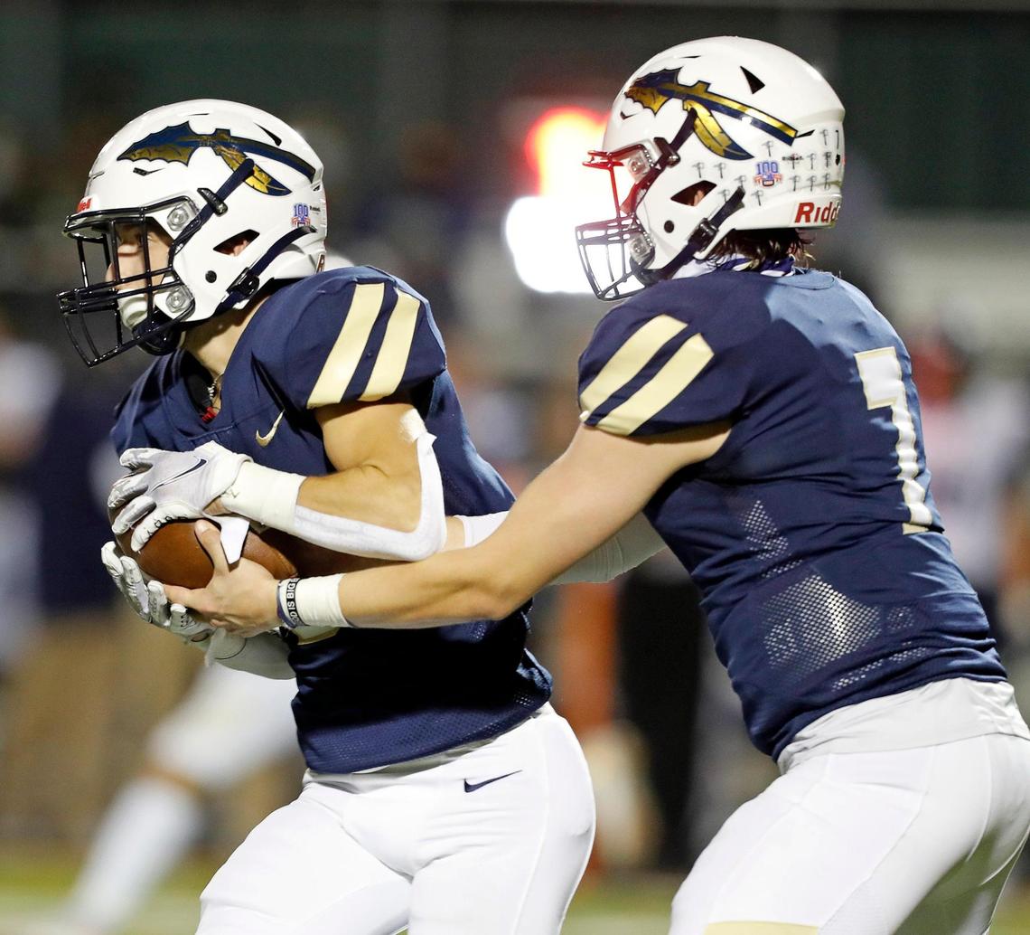 Keller quarterback Clayton Thomas hands the ball to running back Adam Campbell during a high school football game at KISD Stadium in Keller, Texas, Thursday, Nov. 05, 2020. The game was tied at seven at the half. (Special to the Star-Telegram Bob Booth)