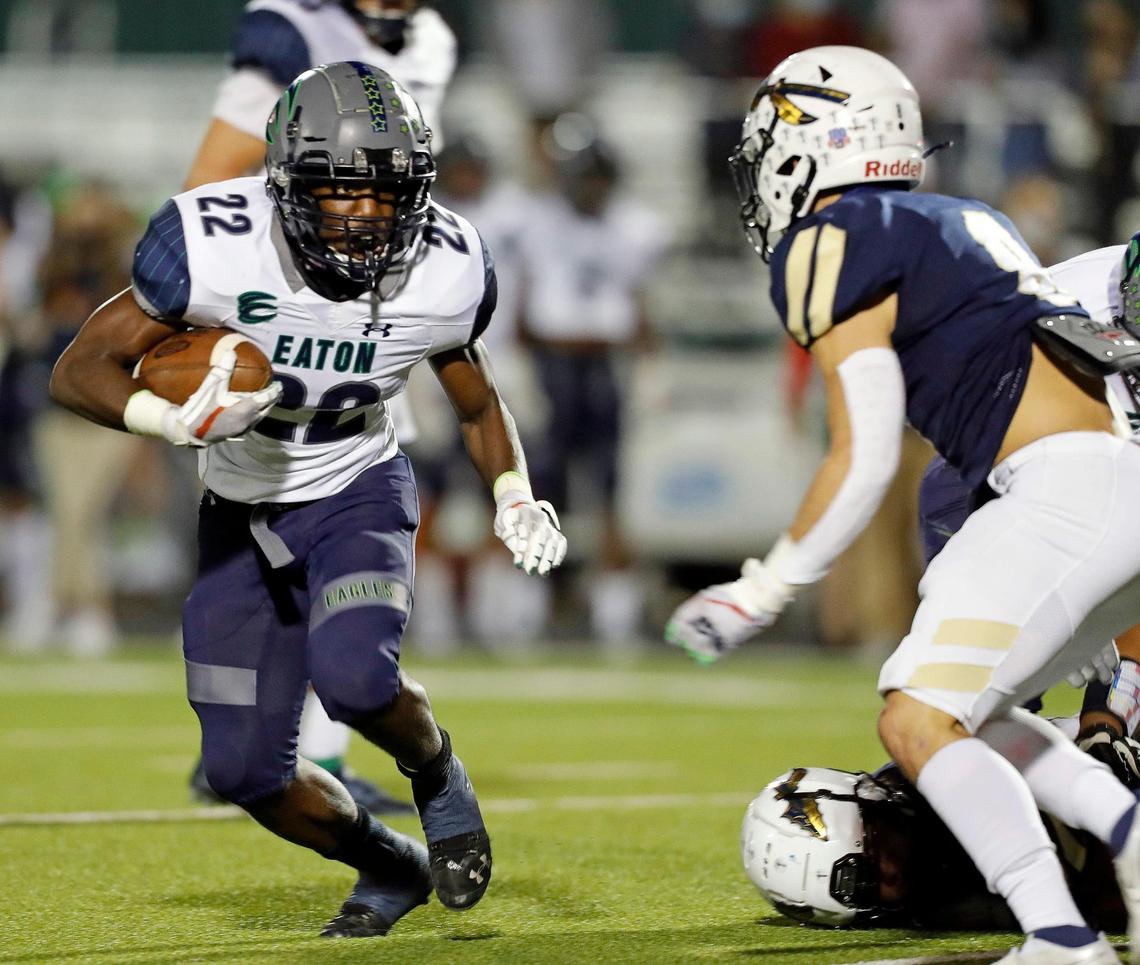 Eaton running back Jahbez Hawkins (22) looks for room around the right side during a high school football game at KISD Stadium in Keller, Texas, Thursday, Nov. 05, 2020. The game was tied at seven at the half. (Special to the Star-Telegram Bob Booth)
