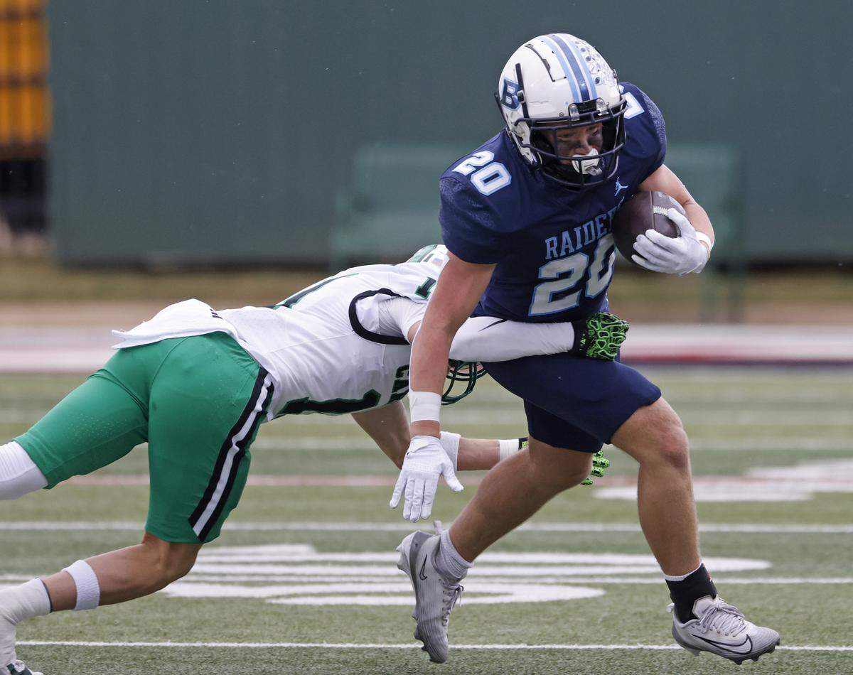L.D. Bell running back Jacob Preskenis (20) is tackled by Southlake defensive back Taevvin Kunz (11) during the first half of a UIL football game between Carroll and L.D. Bell at Pennington Field in Bedford, Texas, Friday, October, 24, 2025.