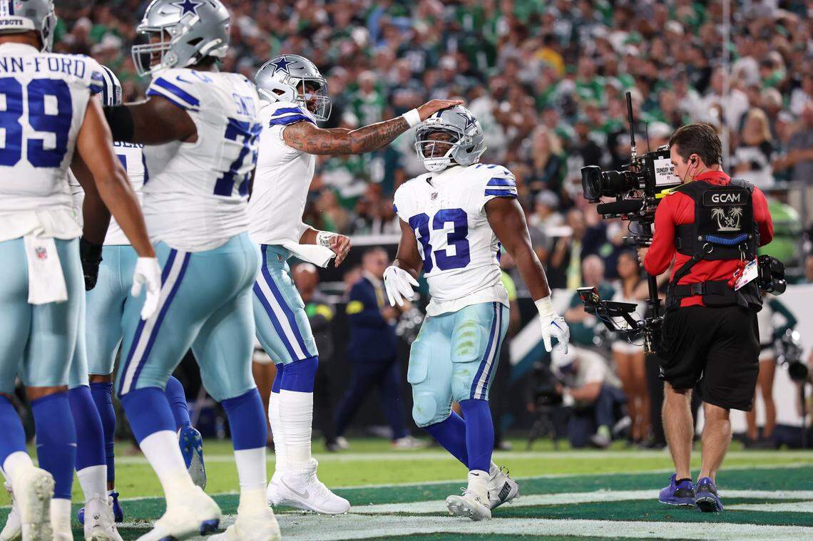 Sep 4, 2025; Philadelphia, Pennsylvania, USA; Dallas Cowboys running back Javonte Williams (33) celebrates with his teammates after scoring a touchdown against the Philadelphia Eagles during the first quarter of the game at Lincoln Financial Field. Mandatory Credit: Bill Streicher-Imagn Images