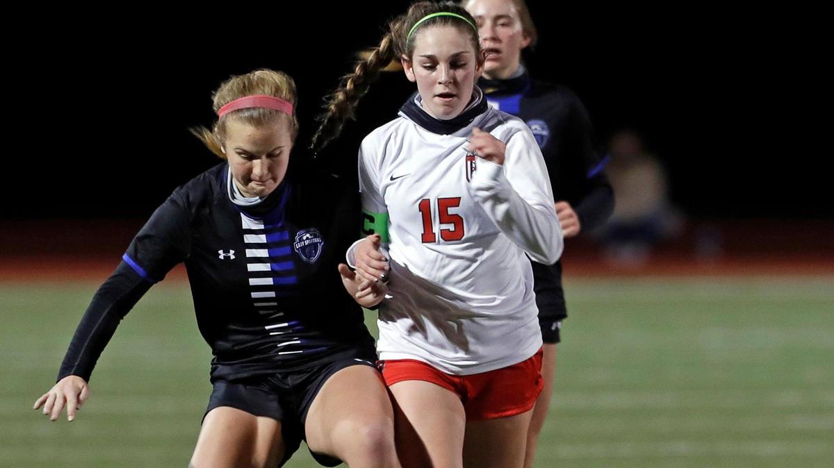 Centennial Brooke Mullins (5) and Burleson defender Kiera Ripper (15) get tripped up fighting for the ball during a 8-5A girls soccer game at Burleson Centennial in Burleson, Texas, Friday, Feb. 05, 2021. Centennial defeated Burleson 6-0. (Special to the Star-Telegram Bob Booth)