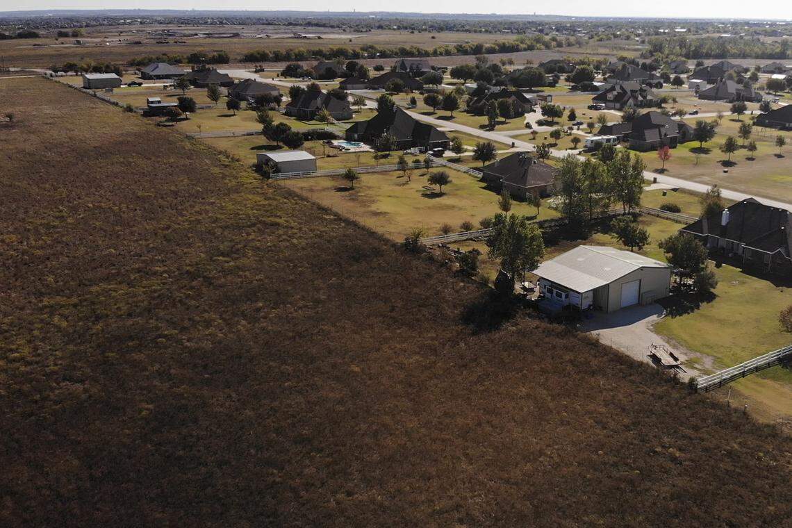 In this file photo from Oct. 31, 2019, agricultural fields end in a community development in Wise County.