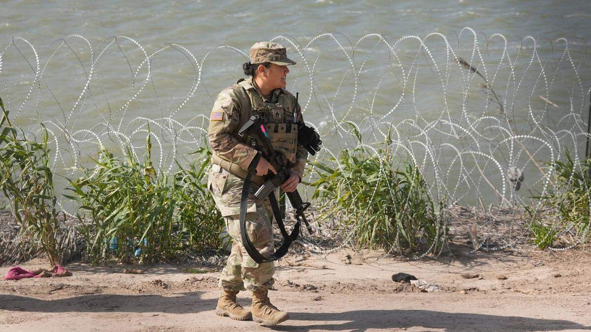 An Army National Guard soldier patrols the banks of the Rio Grande in Eagle Pass on Jan. 8. A bill proposed by U.S. Roger Williams would require the federal government to reimburse Texas for expenses to secure the border.