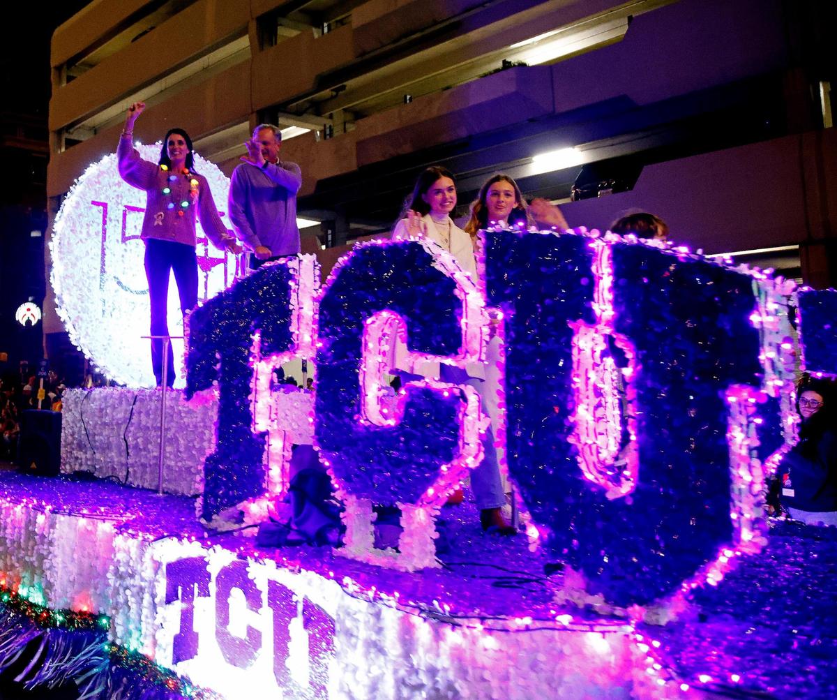 Grand Marshall, TCU head football coach Sonny Dykes and his family rode the 150th anniversary TCU float during the 2023 GM Financial Parade of Lights through downtown Fort Worth, Texas, Sunday, Nov. 19, 2023. This years theme is Magic. (Special to the Star-Telegram Bob Booth)