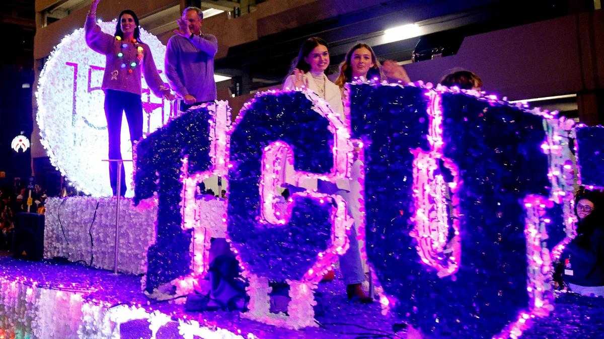 TCU football coach Sonny Dykes and his family rode the 150th anniversary TCU float during the 2023 GM Financial Parade of Lights.