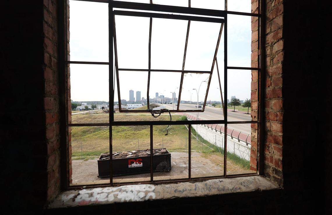 Fort Worth's skyline is framed by the windows of the Fred Rouse Center for Arts and Community Healing, on Tuesday, Aug. 26, 2025. The building was originally contructed in 1924 by rhe Ku Klux Klan. Transform 1012 N. Main Street, a non-profit coalition, acquired the building in 2021.