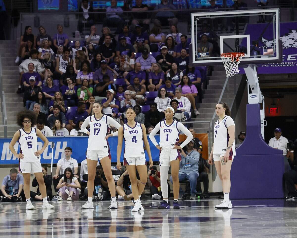 TCU starters, including TCU guards Olivia Miles (5), Donovyn Hunter (4), Taylor Bigby (1), forward Marta Suarez (7) and center Clara Silva (17) wait for Washington to take the court during the first half of a second round NCAA Division I Women's Basketball Championship game at Schollmeier Arena in Fort Worth, Texas, Sunday, March, 22, 2026.