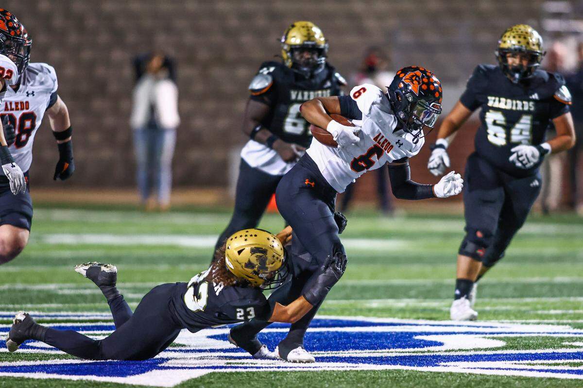 Aledo safety Lamel Swanson gets tackled druing the return of his interception in the second quarter of the Friday, Nov. 22 playoff game at Newsom Stadium in Mansfield. Special to the Star-Telegram / Tom Marvin