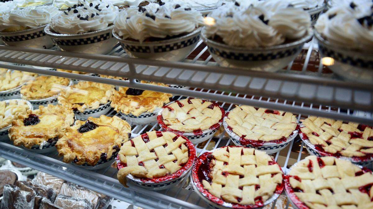 Cobblers, pies and other desserts are displayed in the bakery cabinet at a Black Bear Diner in California.