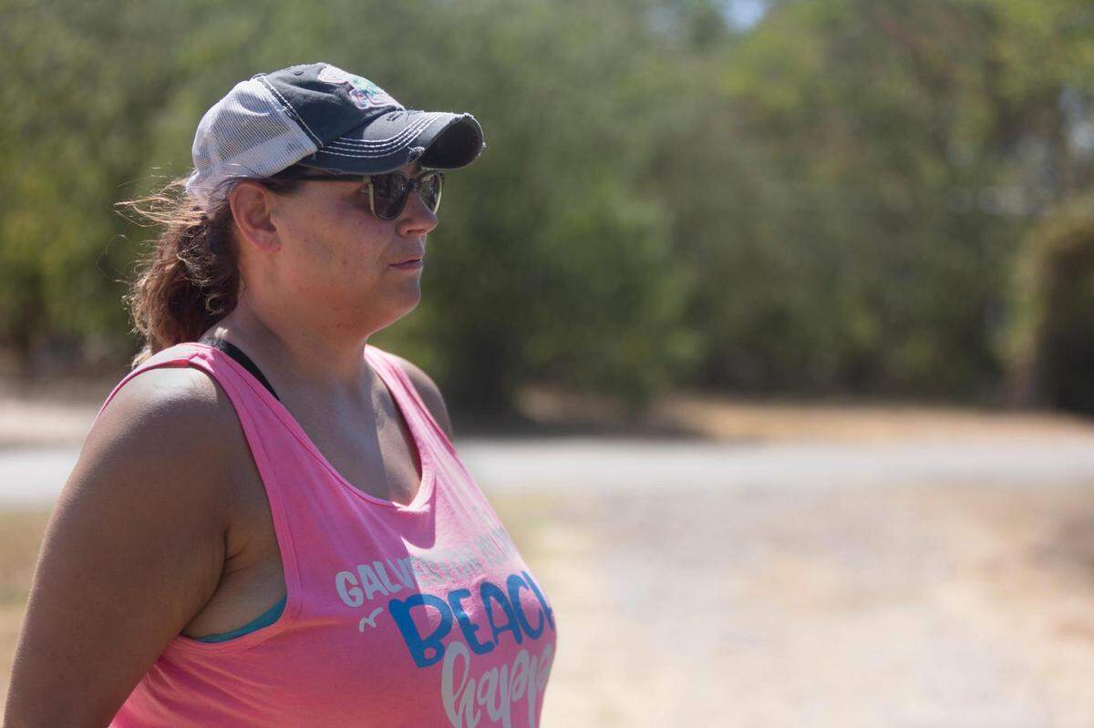 Heather Uselton describes a fire in the home beside her in Rendon, Texas, on Wednesday, July 27, 2022.