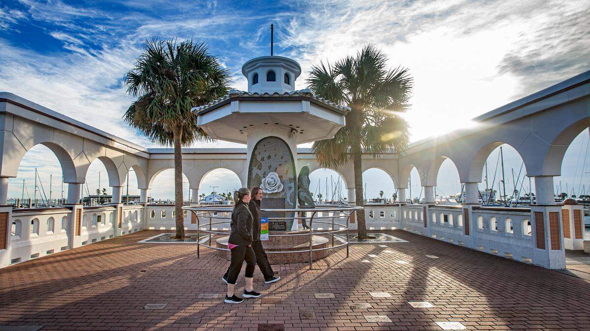 Morning walkers stroll by the memorial of Selena Quintanilla-Perez, the “Queen of Tejano Music”, along the seawall in Corpus Christi, Texas, Wednesday, Nov. 22, 2023. Mirador de la Flor, or Overlook of the Flower, was unveiled in 1997 to honor Quintanilla-Perez and her contributions to music and Corpus Christi. The life-size bronze statue of Selena was sculpted by H.W. “Buddy” Tatum, a Corpus Christi artist. The musician was 24 years old when she died in 1995.
