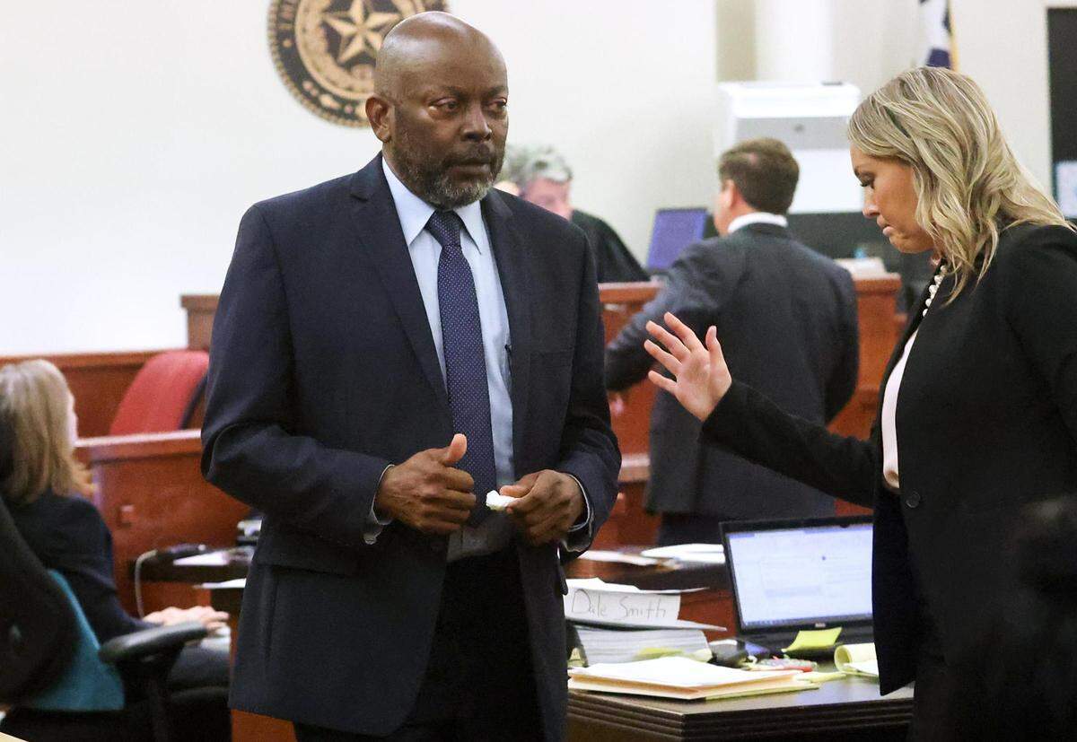 James Smith, the neighbor of Atatiana Jefferson, gives a thumbs up after testifying on the witness stand during the second day of the murder trial of Aaron Dean on Tuesday, Dec. 6, 2022, in Fort Worth. Dean is accused of murder in the shooting of Atatiana Jefferson at her home in 2019.