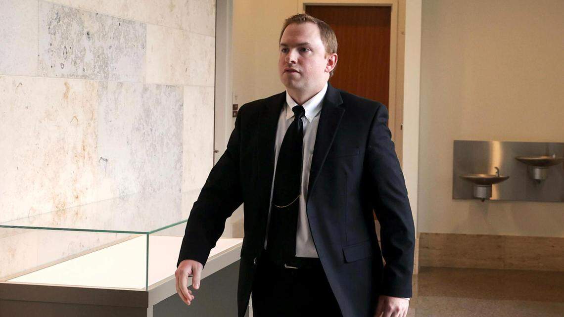 Aaron Dean, who was indicted on murder in the death of Atatiana Jefferson, walks into a courtroom following a break in a pre-trial hearing on May 4, 2022, in Fort Worth.