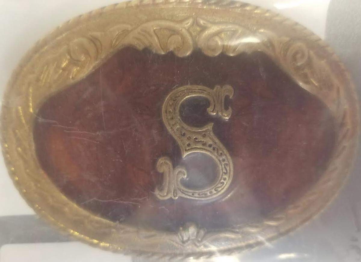 David Shawn Minze used this belt buckle to brand his girlfriend.